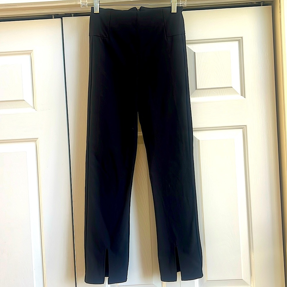 Athleta black flare athleisure pants with front slit at hem